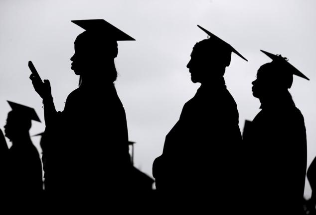 Graduates line up before the start of a community college commencement in East Rutherford, New Jersey USA (AP Photo)