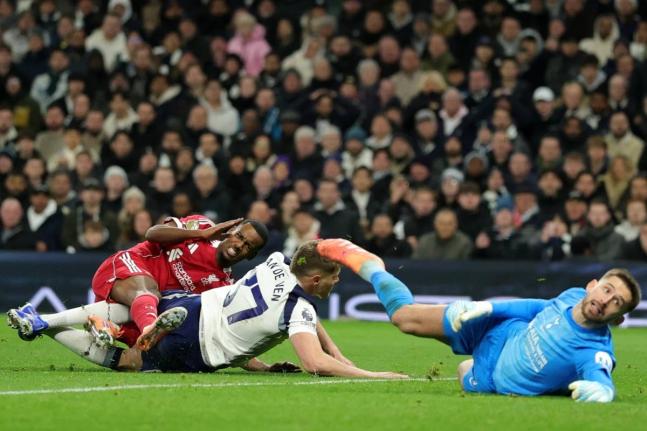 Liverpool’s Alexander Isak (left) grimaces as he picks up an injury in a challenge from Tottenham’s Micky van de Ven as he scores the opening goal during the English Premier League  match between Tottenham and Liverpool in London, Saturday, December 20