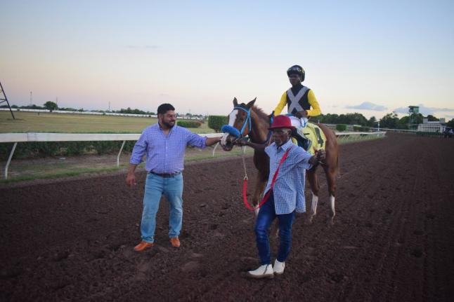
WE JAMMIN, with Omar Walker in the saddle, is flanked by trainer Peter-John Parsard (left) and groom Frank Spencer after capturing the Wayne DaCosta OD Two-year-old Stakes over a mile at Caymanas Park on December 26, 2025.