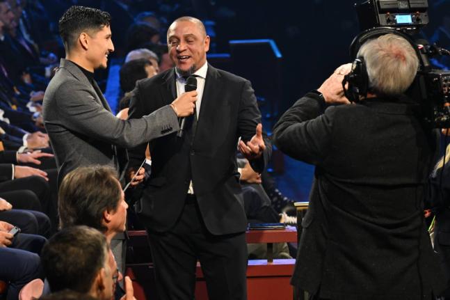 Former Brazil star Roberto Carlos is interviewed by actor Danny Ramirez during the draw for the 2026 FIFA World Cup at the Kennedy Center in Washington on Friday, December 5. 