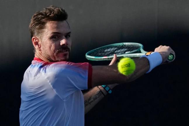 
Stan Wawrinka, of Switzerland, plays a backhand return to Lorenzo Sonego, of Italy, during a first-round match at the Australian Open tennis championship in Melbourne, Australia, on January 14, 2025. 