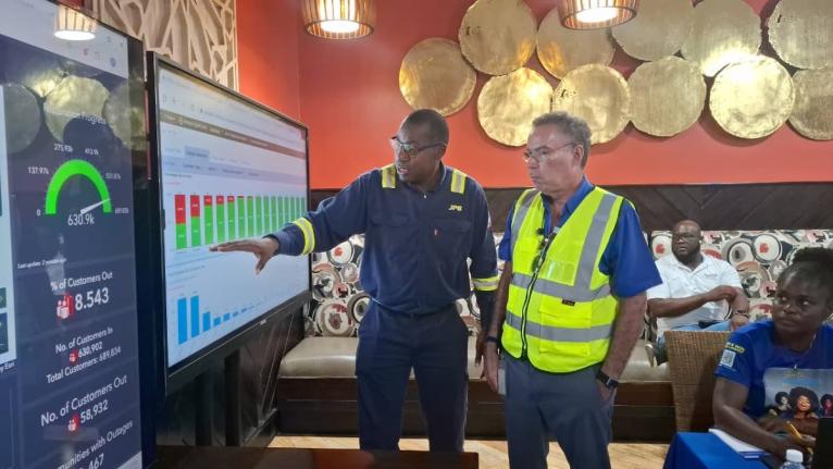 Jamaica Public Service President and CEO Hugh Grant (left) and Minister of Science, Energy, Telecommunications and Transport Daryl Vaz (right) at the JPS Incident Command Centre in Westmoreland, during a tour on post-Hurricane Melissa restoration efforts