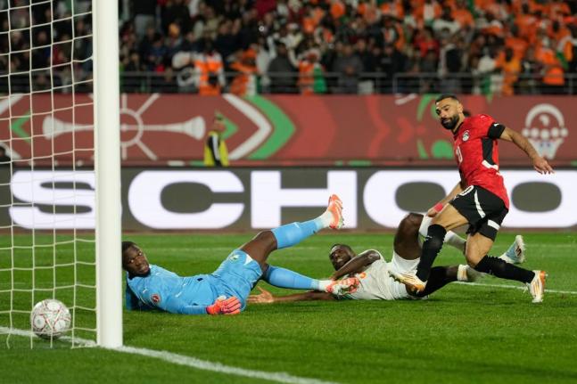 
Egypt’s Mohamed Salah (right) scores his side’s third goal during the Africa Cup of Nations quarterfinal football match against Ivory Coast, in Agadir, Morocco, yesterday.