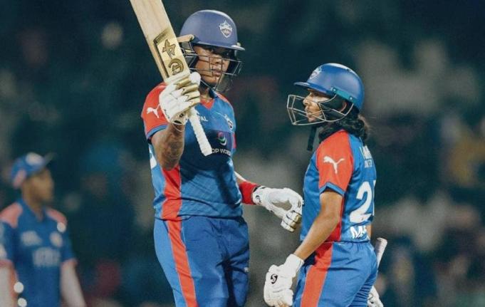 Chinelle Henry (left) celebrates after reaching her half-century for the Delhi Capitals Women during a Women’s Premier League encounter against the Mumbai Indians in Mumbai yesterday. 