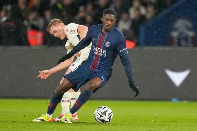 PSG’s Ousmane Dembele (right) turms away from Lille’s Hakon Arnar Haraldsson during the French League One  match between Paris Saint-Germain and Lille in Paris, France, yesterday.