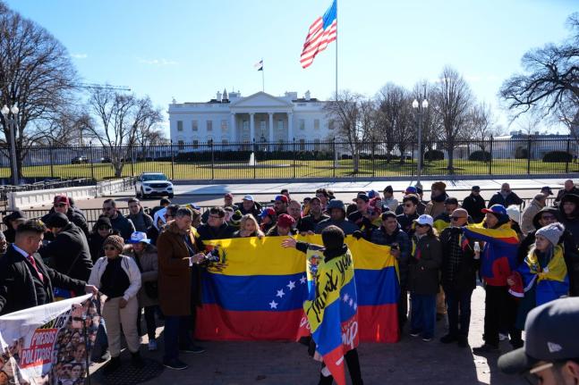 AP 
People rally as Venezuelan opposition leader María Corina Machado meets with President Donald Trump at the White House on January 15 in Washington DC. 