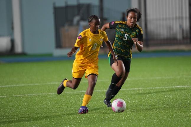 Aruba Under-17’s Zyana Rogers tries to elude Jamaica’s Phylicia Brown during a Concacaf Women’s U17 qualifier at the Stadion Guillermo Prospero Trinidad on Tuesday.