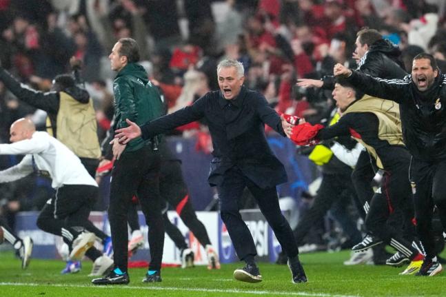 Benfica’s head coach Jose Mourinho (centre) celebrates at the end of a Champions League opening phase match between Benfica and Real Madrid, in Lisbon, Wednesday, January 28, 2026. 