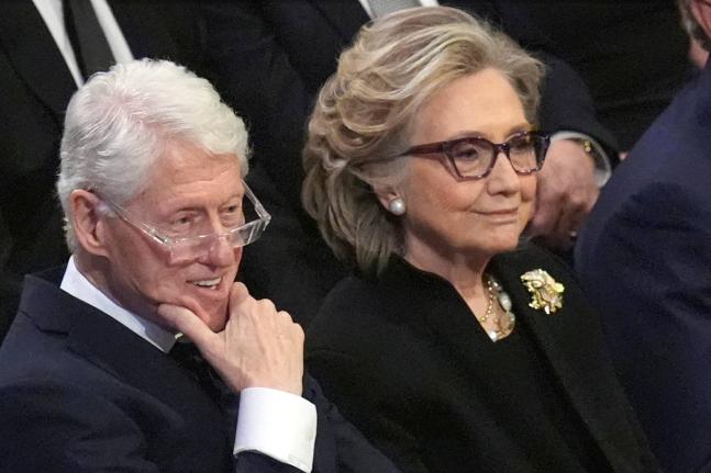 Former President Bill Clinton and former Secretary of State Hillary Clinton listen during the state funeral for former President Jimmy Carter at Washington National Cathedral in Washington, January 9, 2025. (AP Photo/Jacquelyn Martin, File)