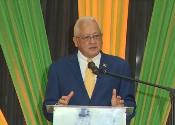 Justice and Constitutional Affairs Minister Delroy Chuck addressing the installation ceremony for 28 new justices of the peace for St James at the Grand-A-View Events Place in Montego Bay, St James, last Friday.