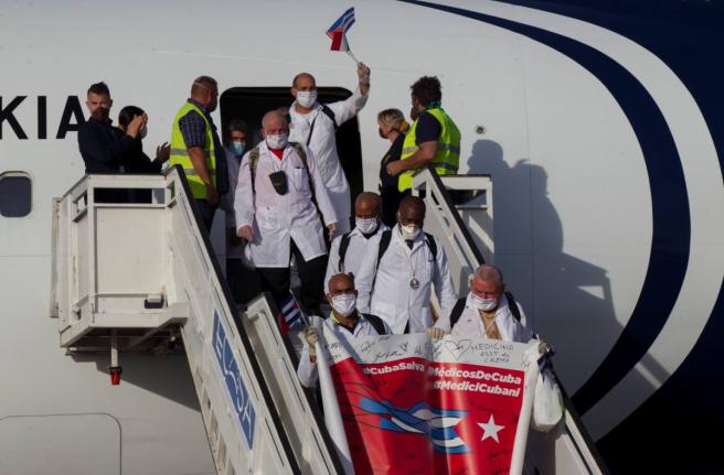 Cuban doctors arrive at the Jose Marti International Airport in Havana, Cuba, June 8, 2020. (Ismael Francisco/Pool via AP, File)