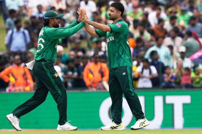 Pakistan’s Abrar Ahmed (right) and teammate Babar Azam celebrate the wicket of Netherlands’ captain Scott Edwards during a T20 World Cup cricket match in Colombo, Sri Lanka on Saturday.