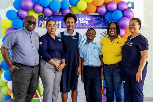 It was all smiles from Christel House Jamaica’s grade seven students (centre) after their Career Day session, discovering careers in science, technology, engineering, arts, and mathematics (S.T.E.A.M.) in the poultry industry. They are joined by the sess