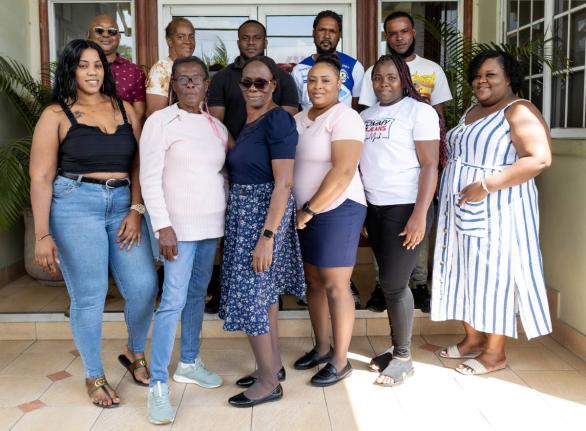 Some of the 20 winners in JMMB Money Transfer’s ‘Share the Love’ promotion pose for a group photo at the recent handover ceremony, which took place at JMMB Group’s headquarters in Kingston. 
