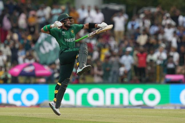 Pakistan’s Sahibzada Farhan celebrates his century during the T20 World Cup cricket match against Namibia in Colombo, Sri Lanka, yesterday.