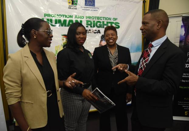 Jamaicans for Justice Executive Director Mickel Jackson (second left) discusses the findings of the Citizens’ Rights. Roles, Responsibilities and Practice Survey 2025 with (from left) Vanna Lawrence, programme manager, Delegation of the European Union to