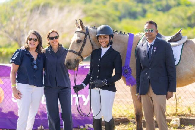 THUNDER, the Best Presented horse winner at the FEI Eventing World Challenge at the Kingston Polo Club on February 8, is pictured with (from left) Samantha Albert, ground jury member; Rosanna Lagunes, judge; Zahra-Lys King, a rider from Trinidad and Tobago