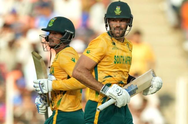 South Africa’ captain Aiden Markram, right, and batting partner Quinton de Kock run between the wickets during the T20 World Cup cricket match between South Africa and West Indies in Ahmedabad, India, Thursday, February 26, 2026. 