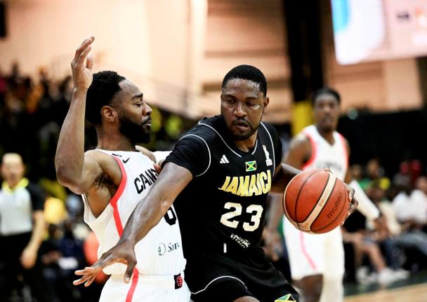 Canada’s Aaron Best stays close to Jamaica’s Tyran De Lattibeaudiere in action from the FIBA World Cup basketball qualifier at the National Indoor Sports Centre last night. Canada won 97-81.