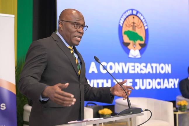 Chief Justice, Bryan Sykes, addresses a recent forum, dubbed 'A Conversation with the Judiciary' held at the Summit in St Andrew.

