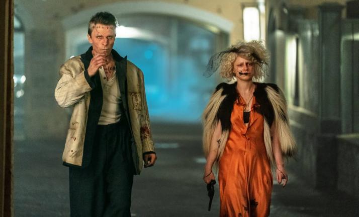 This image released by Warner Bros Entertainment shows Christian Bale and Jessie Buckley in a scene from ‘The Bride!’ 