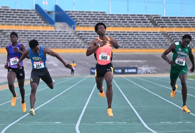 Zachary Wallace (second right) of  Elite Performance Track Club, wins the under-20 400 metres final in  a personal best of 45.77 seconds, ahead of Junior Gallimore (second from left) of Hydel High, who clocked a personal-best 45.87 at the Carifta Trials on