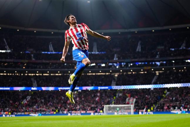 Atlético Madrid’s Robin Le Normand celebrates after scoring his side’s fourth goal during the first leg of the Champions League round-of-16 football match against Tottenham in Madrid, Spain, yesterday.