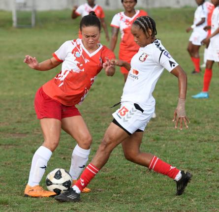 UWI Women’s Caitlyn Sams (left) tries to evade the attentions of Arnett Gardens’ Tuanashe Hamilton during a Jamaica Women’s Premier League football at the UWI Mona Bowl yesterday. Arnett won 3-0.
