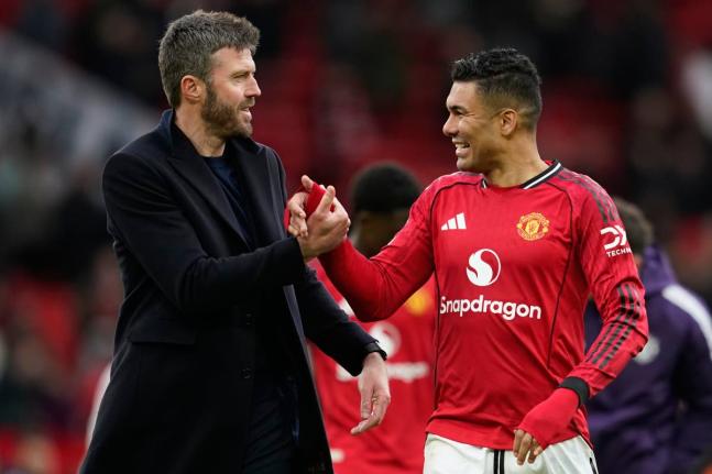 Manchester United's coach Michael Carrick (left) and Casemiro walk off the pitch after the Premier League match between Manchester United and Aston Villa in Manchester, England yesterday.
