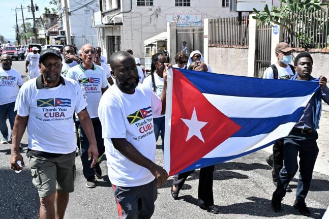 Supporters participating in a walk to show gratitude to Cuban medical professionals. The group walked from Hanover Street to Heroes Circle in Kingston on Tuesday, March 17, 2026
