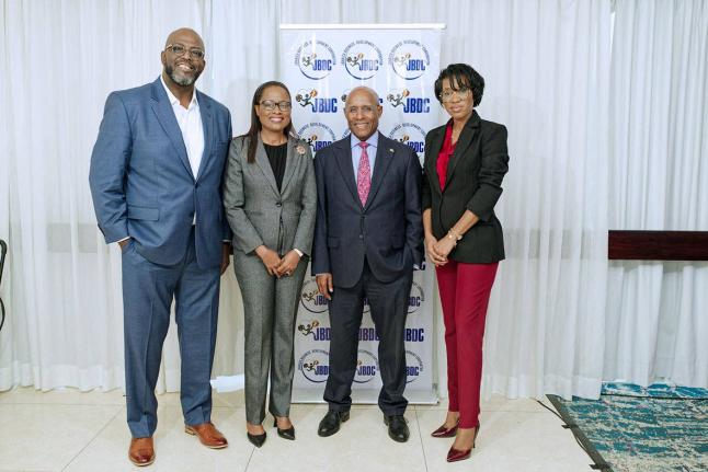 Left to right: Harold Davis, acting CEO of the Jamaica Business Development Corporation (JBDC); Sophia Henry, Permanent Secretary of the Ministry of Commerce, St Lucia; Senator Aubyn Hill, Minister of Industry, Investment and Commerce and, Nadatlie Bastien