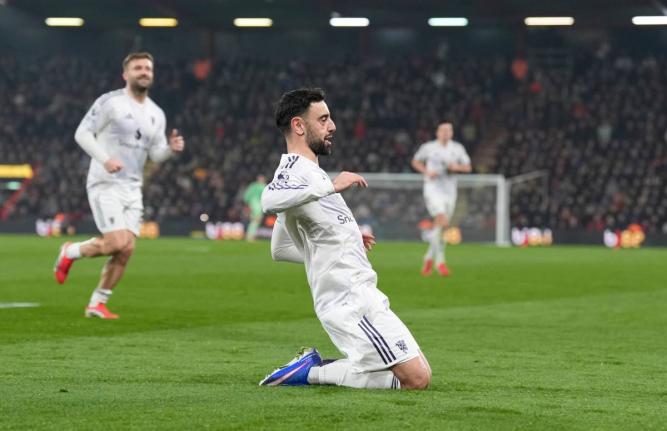 Manchester United’s Bruno Fernandes celebrates after scoring during an English Premier League match against AFC Bournemouth yesterday in Bournemouth, England. The game ended in a 2-2 draw. 