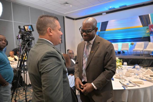 Matthew Samuda, minister of water, environment and climate change, speaks with Ansord Hewitt, director general of the Office of Utilities Regulation (OUR) at the 12th Annual Director General’s Stakeholders’ Engagement held last Thursday at The Jamaica 