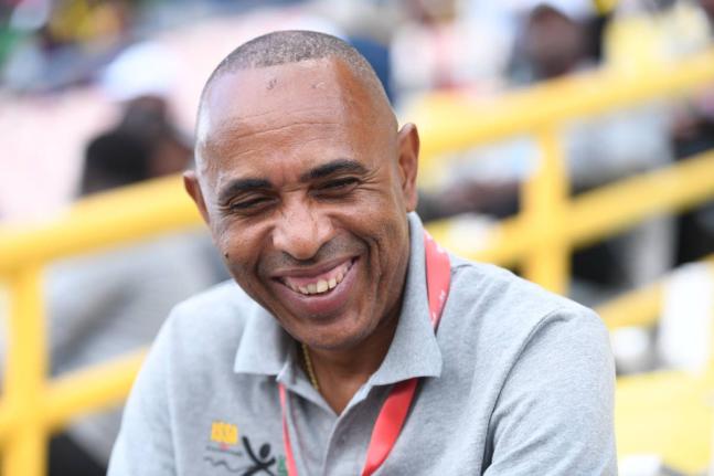 ISSA President Keith Wellington is all smiles on day one of the ISSA/GraceeKennedy Boys and Girls’ Athletics Championships inside the National Stadium yesterday.