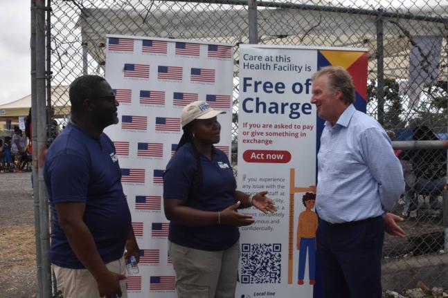 Scott Renner (right), United States Embassy chargé d’affaires in Kingston, is provided with an update on the Hope Mobile Clinic in Barrett Town, St James, by Dr Didinu Tamaklor, country director for Project Hope, and Kamesha Kelly-Swaby, emergency respo