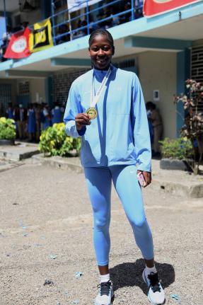 Brittany Baron of Edwin Allen High School is celebrated for her outstanding performance during a ceremony at the school yesterday.