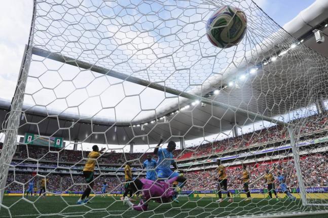 DR Congo’s Axel Tuanzebe (centre) scores the game’s only goal during the World Cup Intercontinental Play-off final match against Jamaica in Guadalajara, Mexico, on Tuesday, March 31.