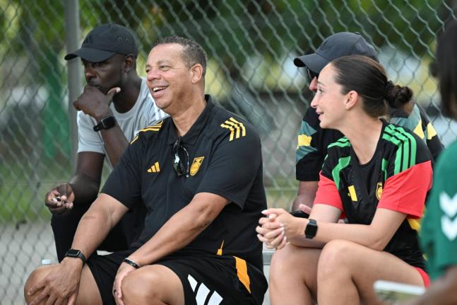 
National Women’s coach Hubert Busby Jr with his coaching staff at the Jamaica Women’s Premier league encounter between Cavalier and UWI at the Alpha Institute yesterday.