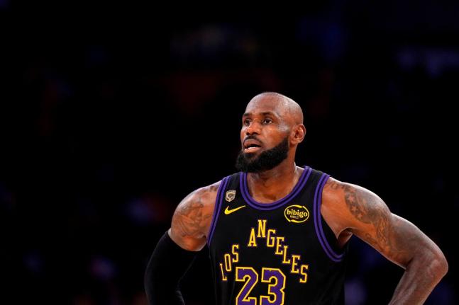 FILE - Los Angeles Lakers forward LeBron James stands on the court in the closing minutes of Game 4 in a second-round NBA basketball playoffs series against the Oklahoma City Thunder, May 11, 2026, in Los Angeles. (AP Photo/Mark J. Terrill, File)
