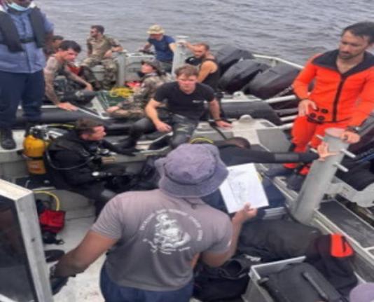 Divers resting after searching for survivors of the MV Barima tragedy in Guyana.
