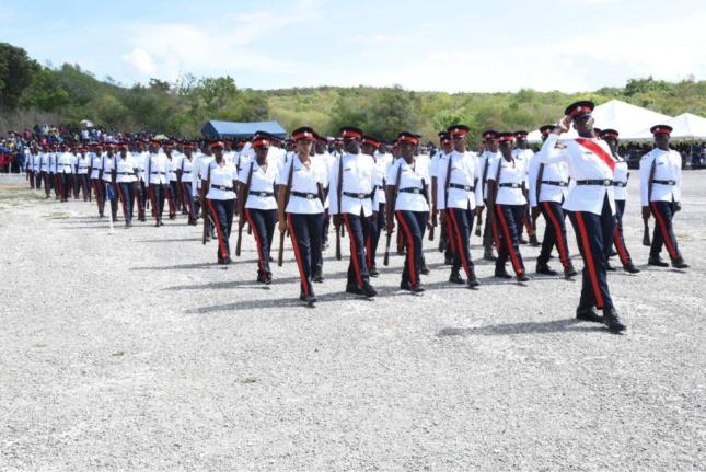 Former recruits marching in unison at a Jamaica Constabulary Force passing out parade and awards ceremony.