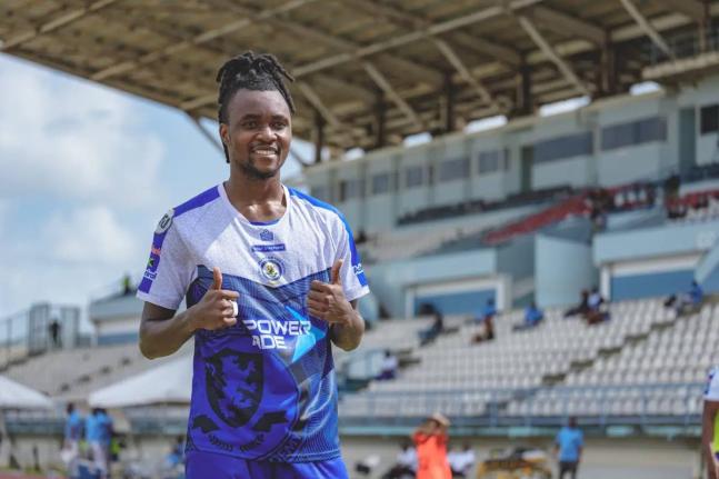Mount Pleasant’s Johnson Juedy celebrates gives a thumbs up after scoring in the quarterfinal of the Caribbean Club Shield against Weymouth Wales at the Larry Gomes Stadium in Arima, Trinidad yesterday. 