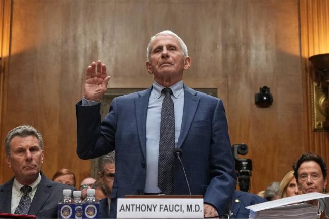 Dr Anthony Fauci is sworn in before the Senate Homeland Security and Governmental Affairs Committee at the Capitol, Wednesday, in Washington.
