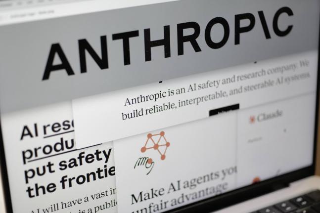 Pages from the Anthropic website and the company’s logo are displayed on a computer screen in New York, Feb. 26, 2026. 