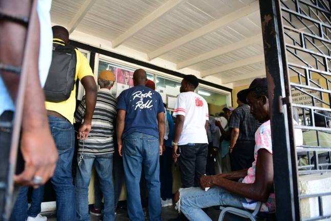 Persons at the Spanish Town Road Examination Depot in Kingston.