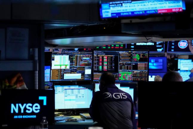 Specialist Dilip Patel works on the floor of the New York Stock Exchange, Thursday, July 30, 2026, in New York. 