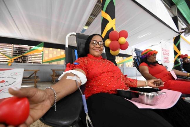Sonya Binns-Lawrence, Jamaica’s top female blood donor, gives blood during her birthday blood drive, held on the grounds of Kencot Seventh-day Adventist Church in Kingston last February. 