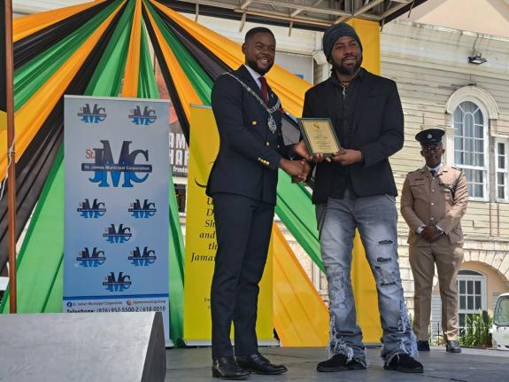 Reggae artiste Hezron Clarke (right) receives his 2026 Spirit of Independence Award from Montego Bay Mayor Richard Vernon during the annual Independence Day Flag Raising and Civic Ceremony in Montego Bay on Thursday.
