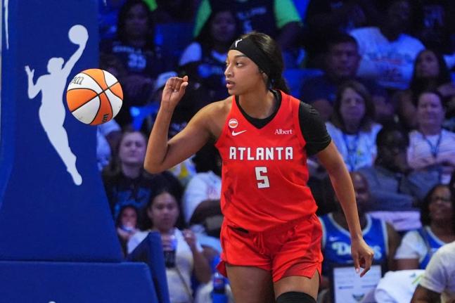 Atlanta Dream forward Angel Reese gestures after scoring a basket during the first half of a WNBA basketball game against the Dallas Wings in Arlington, Texas, Wednesday, July 29, 2026. 