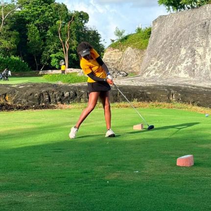 Courtesy of @jamaicagolfassociation/IG 
Kierra Williams gets ready to swing during the Caribbean Amateur Golf Championships at the Royal Blue Golf Course in Nassau, Bahamas.